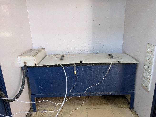 A blue and white box with wires
AI-generated content may be incorrect.